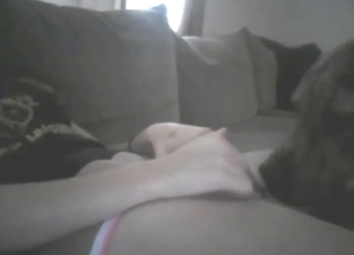 Hot solo babe is happy to let this dog lick her